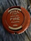 Round red metal standard fire alarm -not pulled “Pull for a local fire alarm”