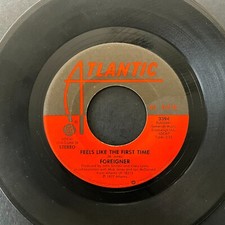 Foreigner, Feels Like The First Time / Woman Oh Woman, 7" 45rpm, Vinyl VG+