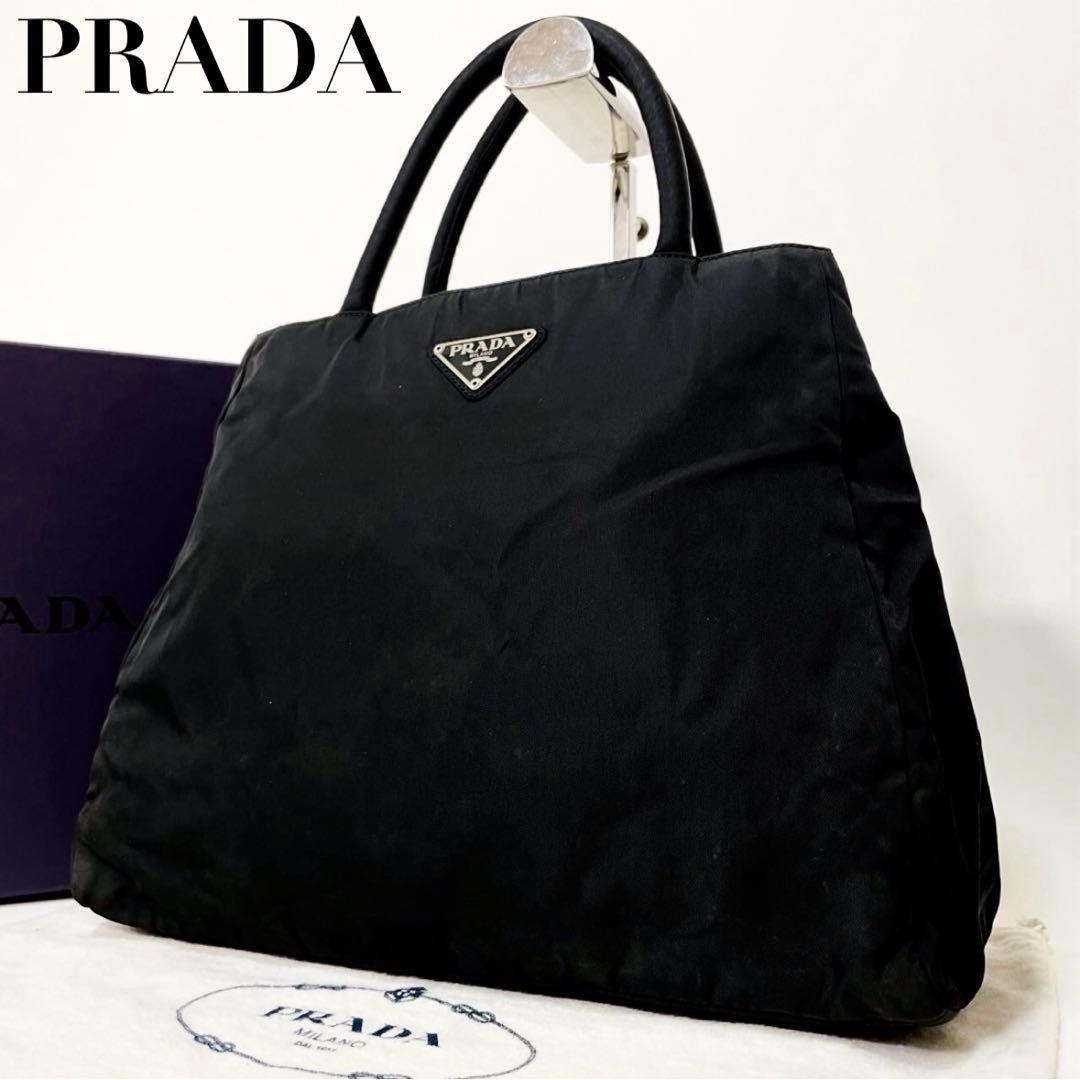Prada black nylon tote bag with triangle logo and trapezoid shape