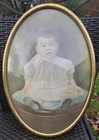 Antique Gold Metal Frame w/ Oval Bubble Glass W/ Photo Of Child — photo 1