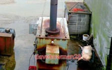 PHOTO  GRAND PIG ROAST A CASUALTY PIG WAITS NEXT TO AN OVEN TO BE INCINERATED AT