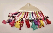 Vintage New Old Stock 1980's Plastic Clip On Bell Charms AX Pistol Toilet Skate