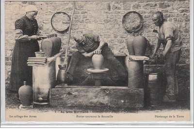 NORON LA POTERIE: Norman sandstone - potter turning bottle - very good