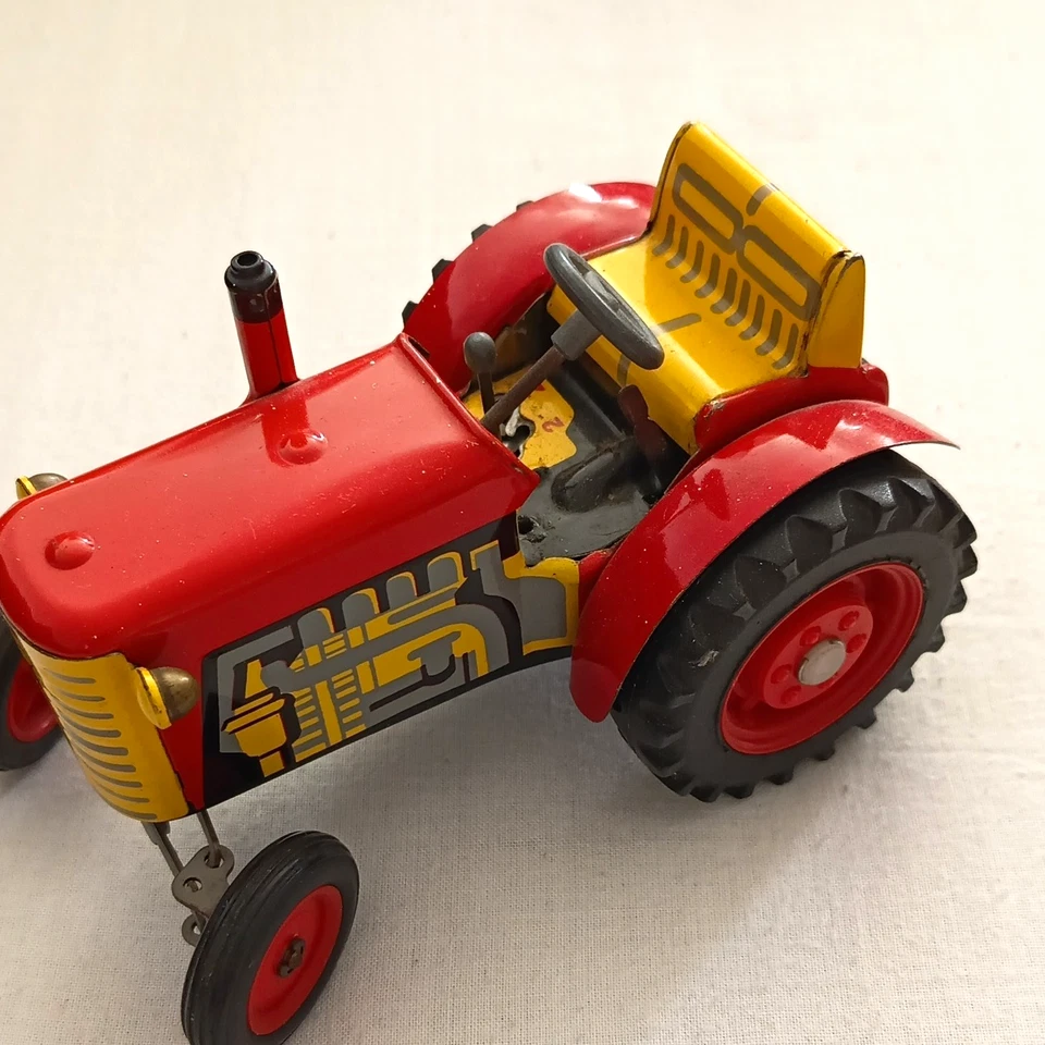 Blech Spielzeug Traktor rot und gelb mit Uhrwerk und Gummireifen - Bild 1 von 3