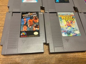 Lot of 8 Nintendo NES games including Mega Man 2 And 3 Mario 2 And 3 WWF Etc