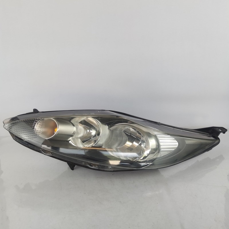 1734615 Proiettore SX FORD FIESTA (CB1) 1.4 16V (71Kw) Ber. 5p/b-g/1388cc