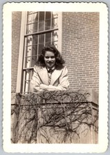 Vtg B&W Snapshot Smiling Woman Brick Building 1942
