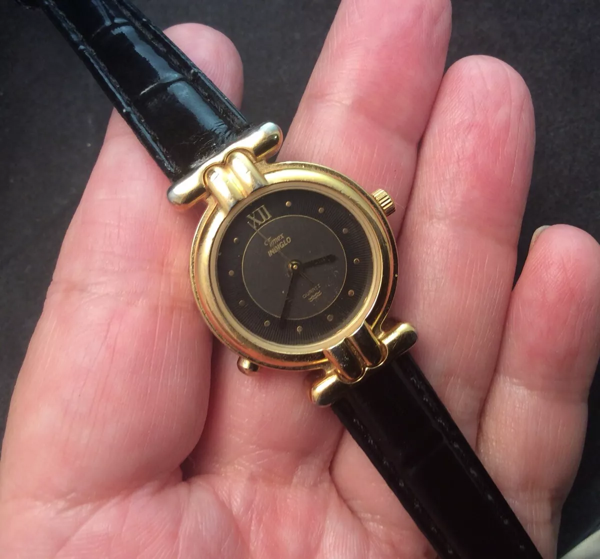 Very Nice Timex Gold Tone Water Resistant Quartz Watch With Black Leather Band