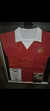 1970s Replica Man Utd Shirt Signed By United Legend Dennis Law. Comes With Cert