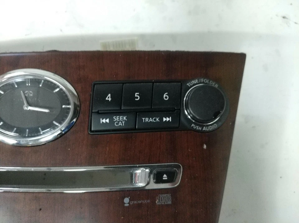 INFINITI M35 M45 2006-2009 OEM REPRODUCTOR DE CD INTERRUPTOR REPRODUCTOR DE CD PANEL FRONTAL MOLDURA Foto 2 de 4