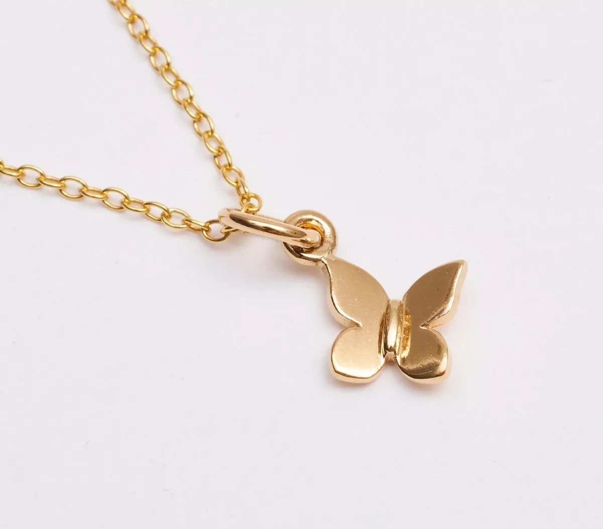 Solid gold hotsell butterfly pendant