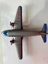 Vintage Schylling tin DC toy airplane, friction mtor turning propellers
