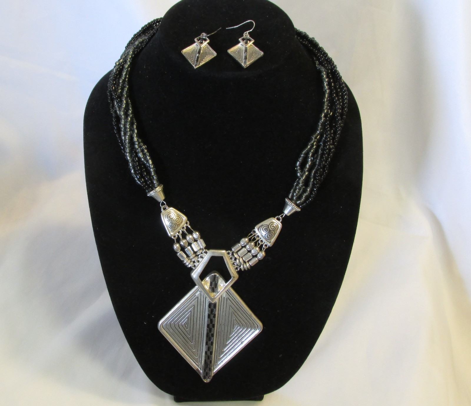Silver tone statement  necklace and earring with plastic gray and black beads