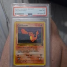 Charmander 50/82 Team Rocket Regular PSA 8