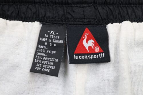 Points de vente Pantalon de jogging vintage 90 Le Coq Sportif homme XL doublé évasé nylon noir
