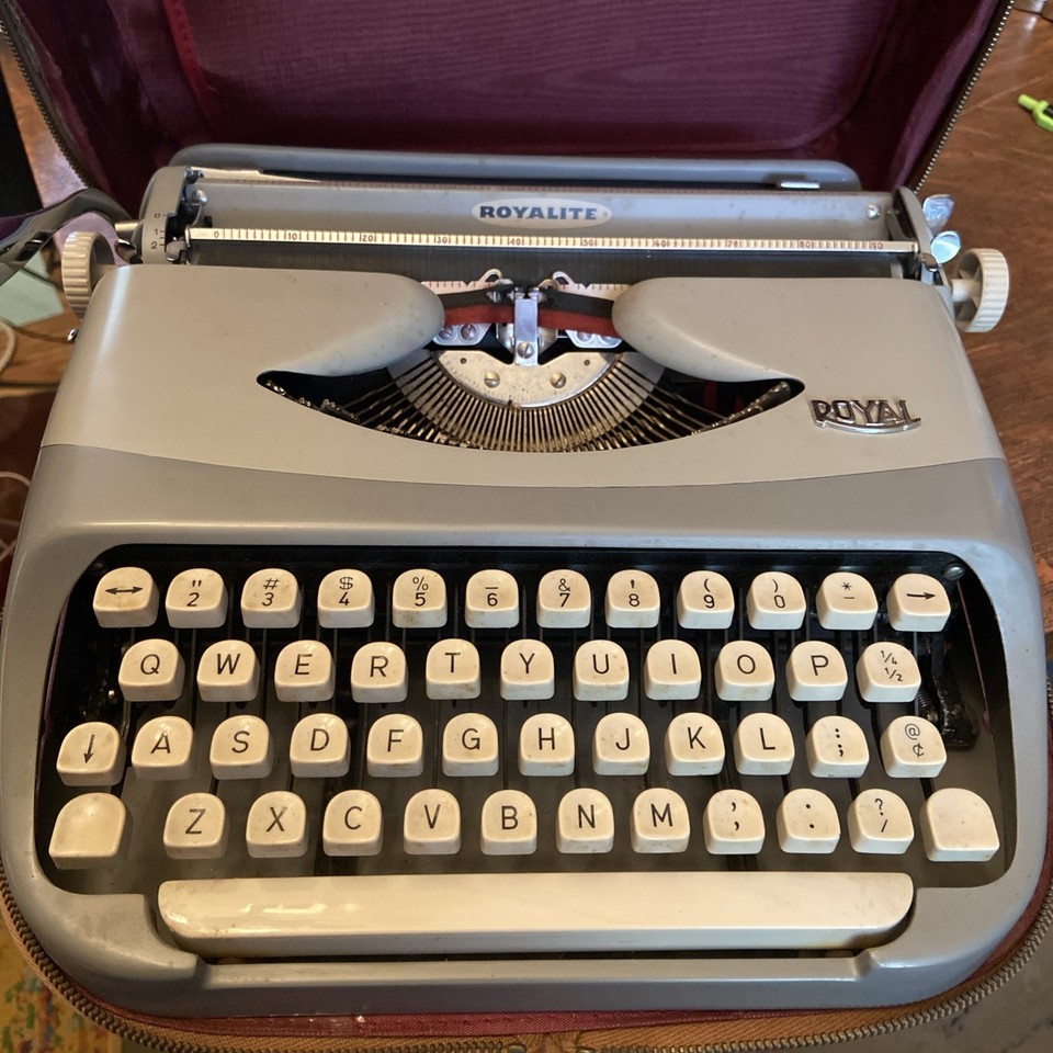 A Dutch-made Royal Royalite in its original leather travel case — the European provenance and leather case make this feel genuinely special.