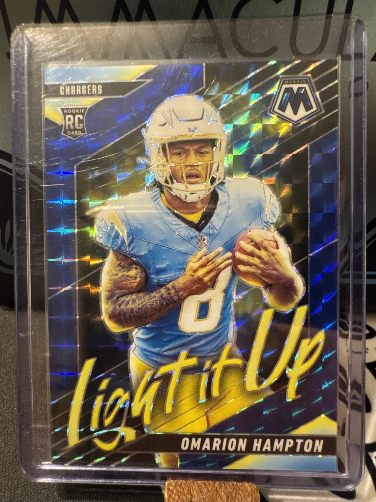2025 Panini Mosaic - Light It Up Mosaic Omarion Hampton #12 Blue Prizm /99 (RC)
