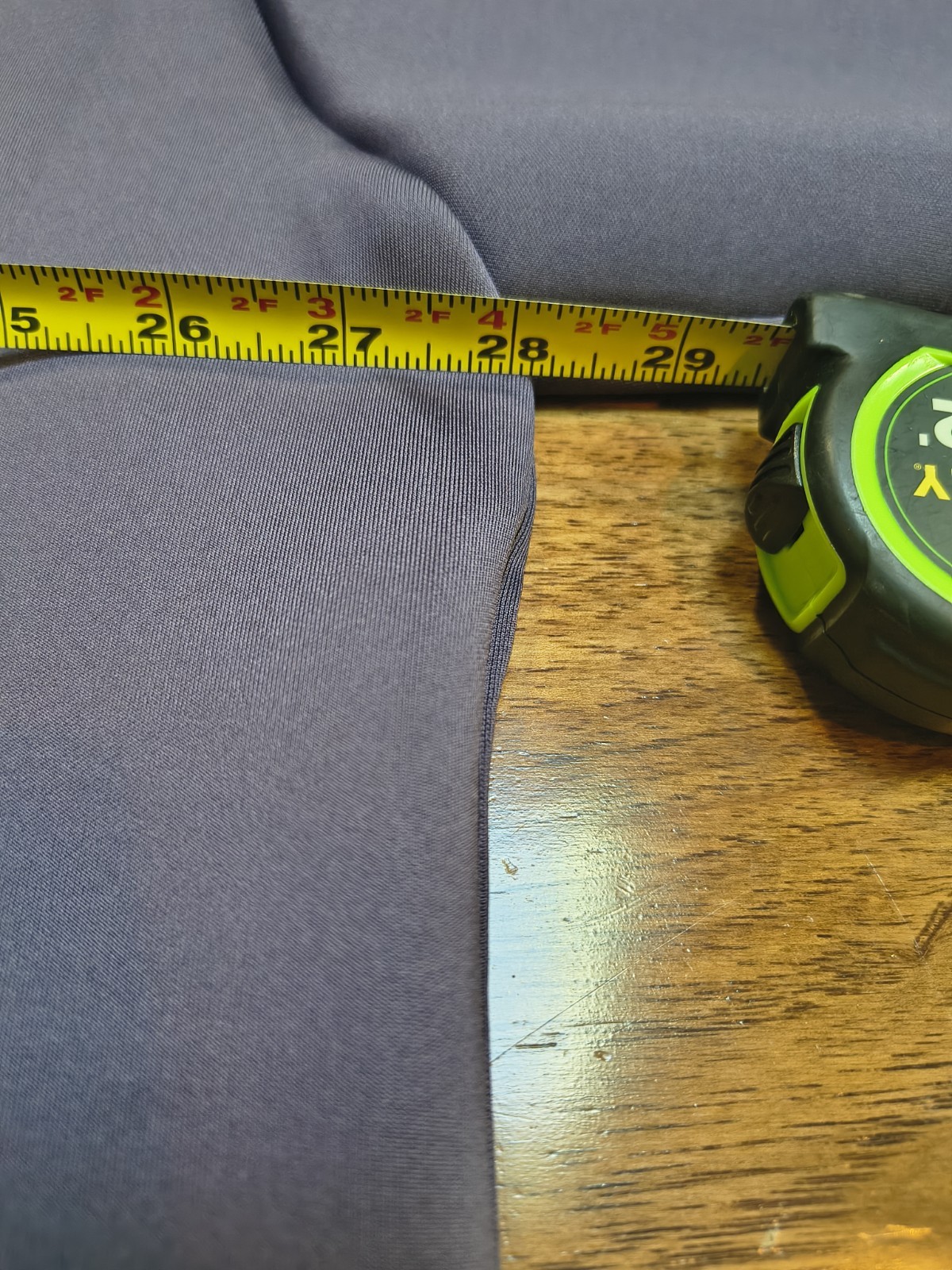 Gray Nike Project FROG hoodie, size XL, with yellow tape measure on left chest, shown alongside black swoosh logo.