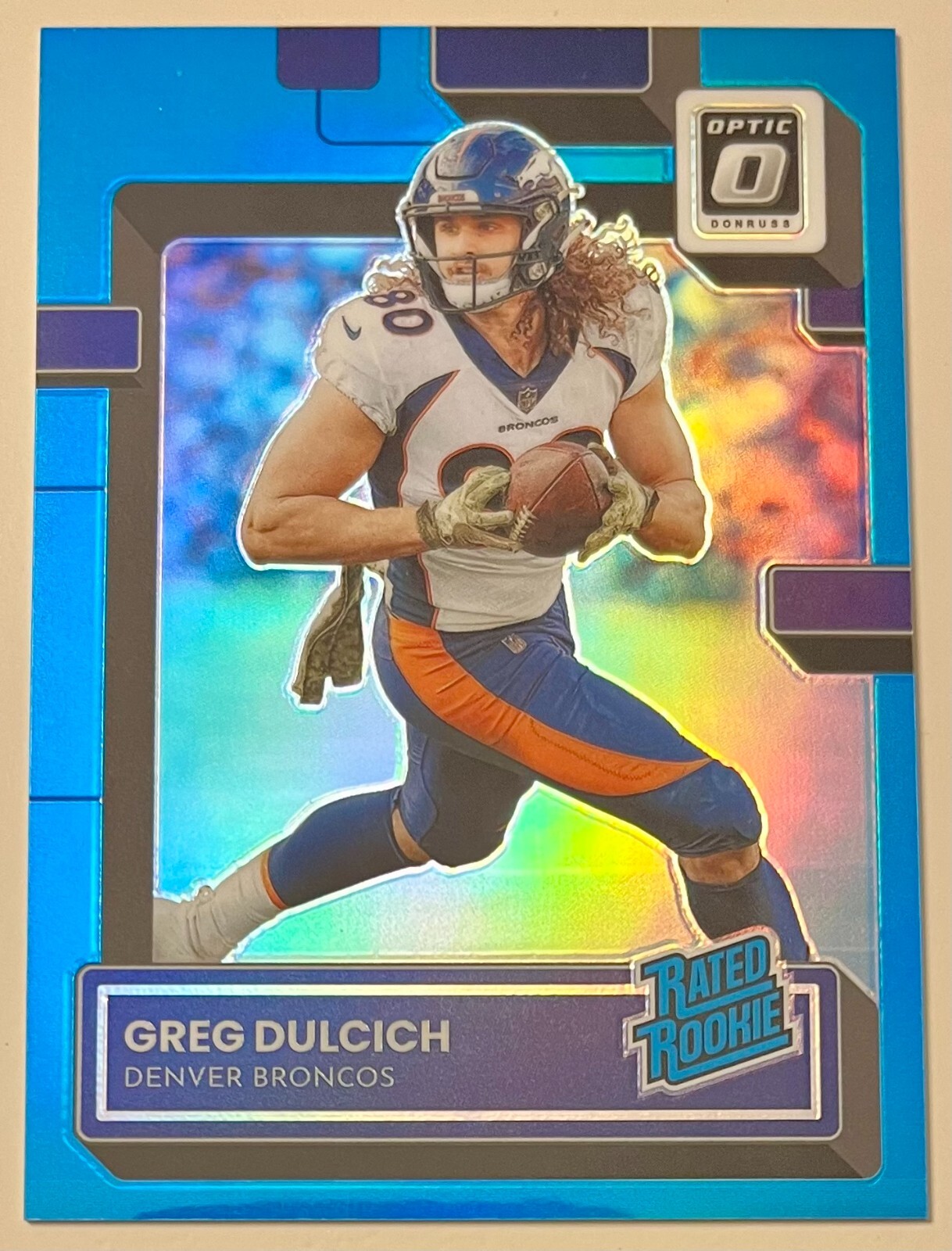 2022 Donruss Optic AQUA #288 Greg Dulcich RC /299 - UCLA 🔵🟡 - BRONCOS 🔵🟠