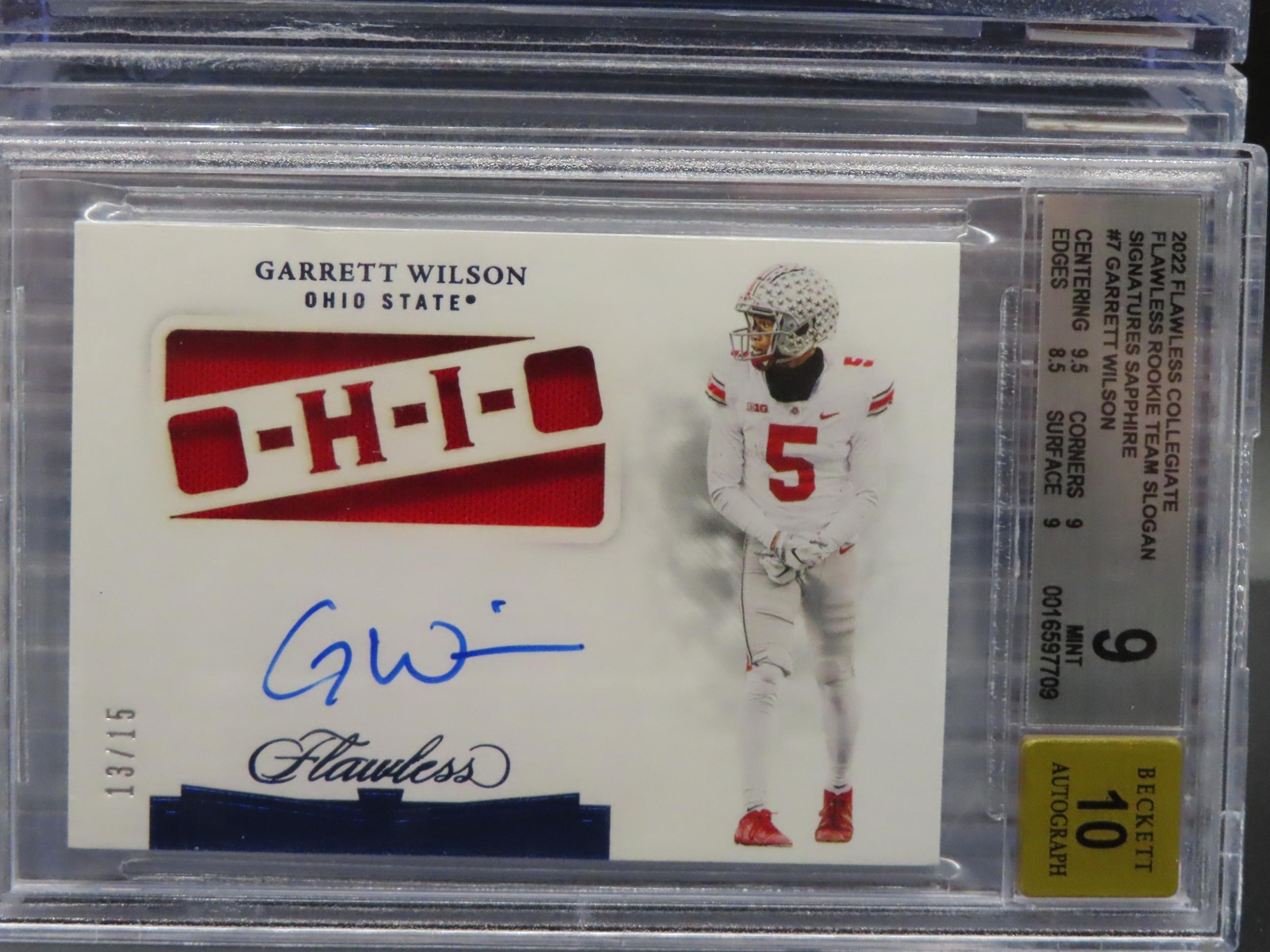 Garrett Wilson Panini Flawless Collegiate Flawless Rookie Team Slogan Signatures #SLOGWI Sapphire