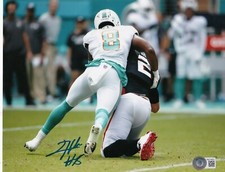 JEVON HOLLAND  MIAMI DOLPHINS  BECKETT AUTHENTICATED   ACTION SIGNED 8X10