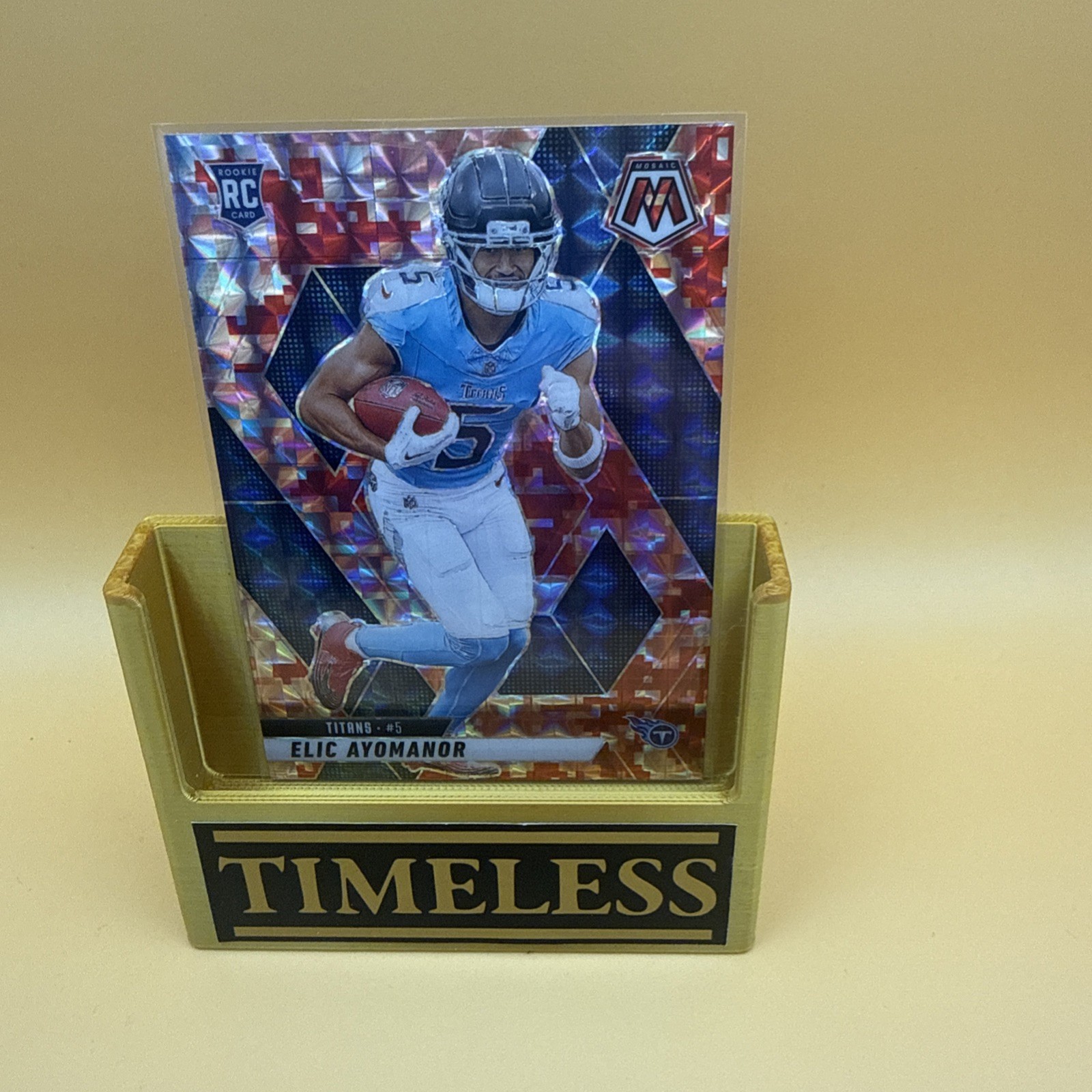 2025 Mosaic Elic Ayomanor Red Camo Prizm #333 Titans