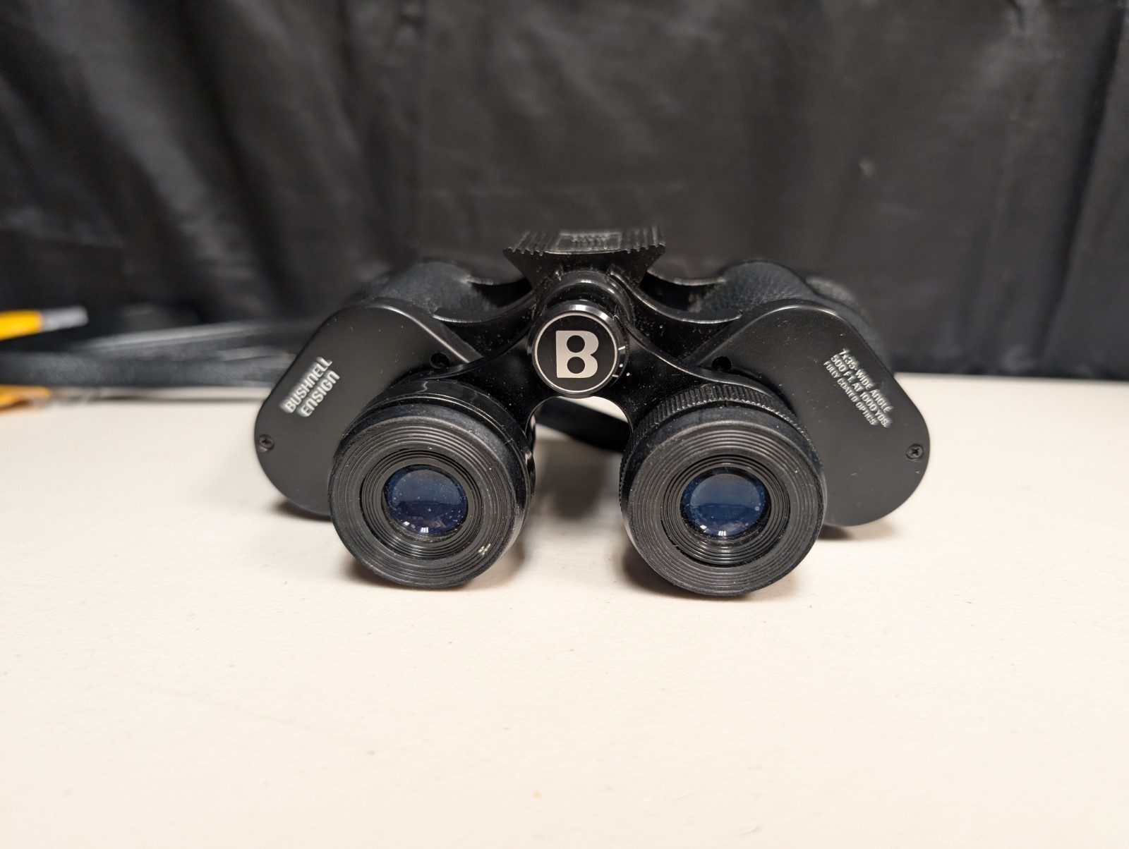 как выглядит Bushnell Binoculars Ensign Insta-Focus 7x35 Wide Angle 500 ft 1000 yd Case фото