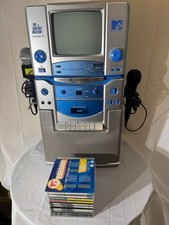 The MTV Karaoke "The Singing Machine" Model STVG-700 w/ CDs Two Microphones