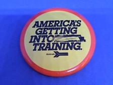 VTG ADVERTISING PINBACK BUTTON AMTRAK “AMERICA’S GETTING INTO TRAINING”