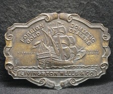 XC19134 VINTAGE 1970s LIVINGSTON WELLS  CO. FOREIGN GOLD DEALERS BELT BUCKLE