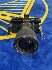 Olympus om-1n with Tokina AT-X 28-85mm 1:3.5-4.5 Lens Lens Black