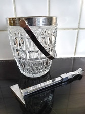 Excellent retro chrome and glass ice bucket with ice pick ice tongs.