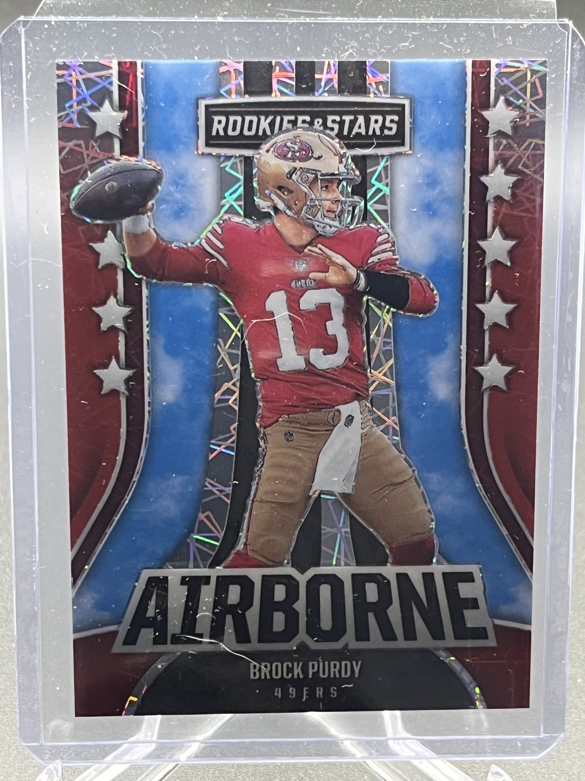2023 Panini Rookies & Stars - Airborne Brock Purdy #AI-28 Longevity Prizm