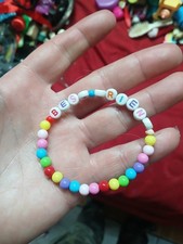 colorful beaded bracelet is a friendship bracelet featuring letter beads that...