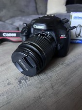Canon EOS Rebel T100 DSLR Camera with 18-55mm Lens, Charger, and Batteries