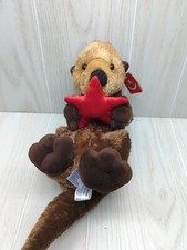 Aurora Plush sea river otter on back holding red starfish Unused with tags 2022