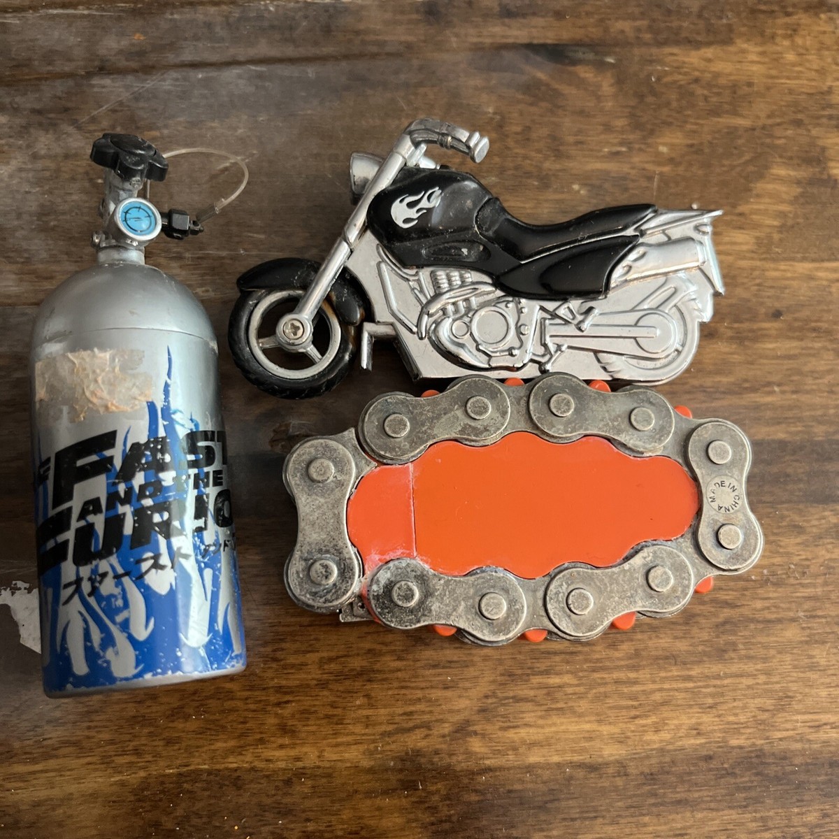 3 Vintage Cigarette Lighters Fast And Furious, ￼ motorcycle, and chain  untested