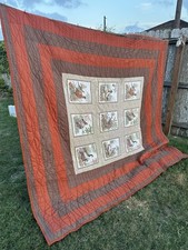 Handmade Or Machine Made quilt birds in decorative squares and striped border.