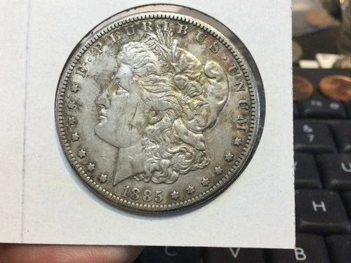 1885-S About Uncirculated 90% silver Morgan dollar.