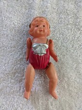 4" Celluloid Girl doll Molded body has cute sunsuit with bow Jointed arms/legs