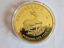 South Africa 1967 Krugerrand Gold-plated coin. Pre-owned in fair-good condition.