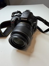 Nikon D5100 Camera Bundle with 18-55mm VR Lens, Battery, Charger, Bag