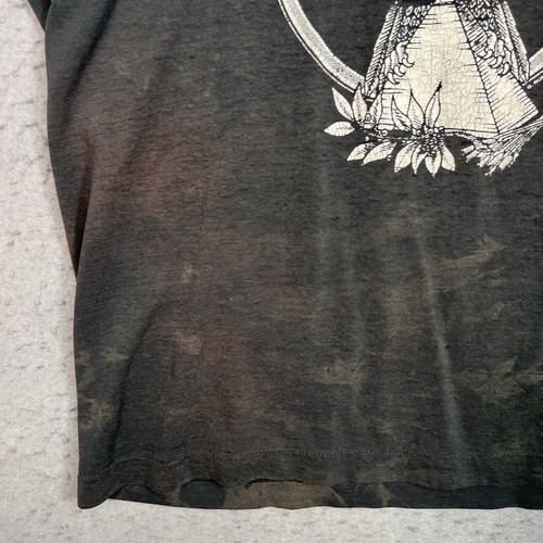 Black vintage Tora Tora Wild In Memphis Again T shirt with white floral and mandala design on front, small chest graphic on sleeve.