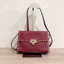 Valentino Garavani Pebbled Calfskin Medium Rockstud Flip Lock Crossbody Bag Red