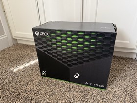 Microsoft Xbox Series X 1TB Console with two Microsoft controllers, battery pack