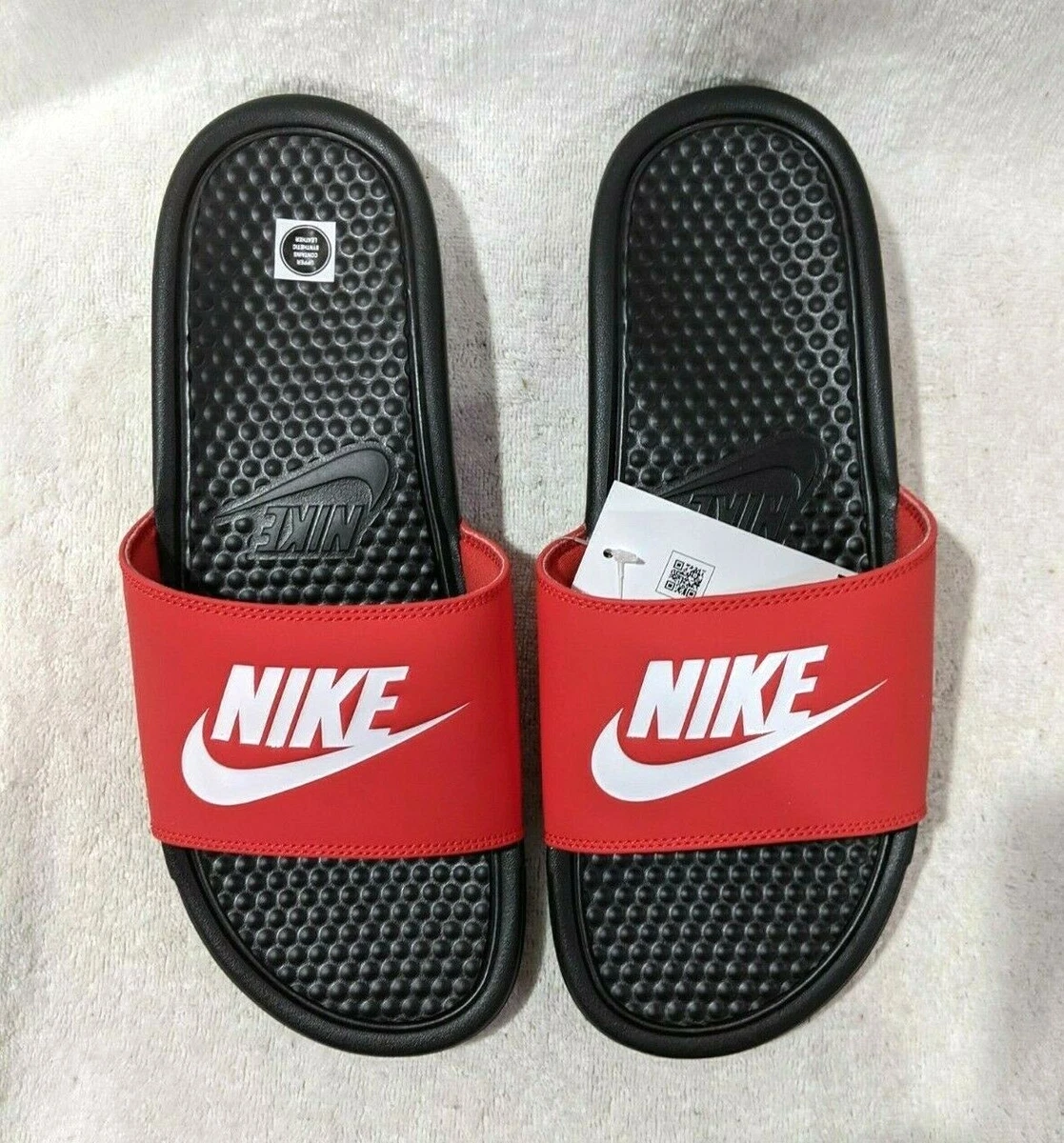 Black white and top red nike slides