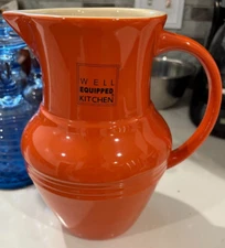 Well Equipped Kitchen Orange Pitcher 9" tall