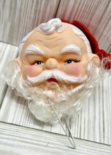 Vintage Rubber Santa Head With Hat On Wire 3" x 3"
