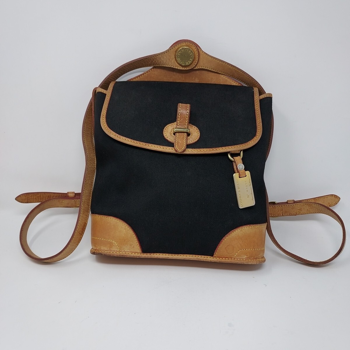 black and tan leather backpack Dooney & Bourke Backpack Black Canvas Tan Leather Buckle Closure Vintage  Rare
