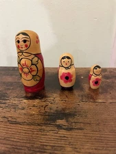 A Set Of 3 Small Russian Nesting Dolls